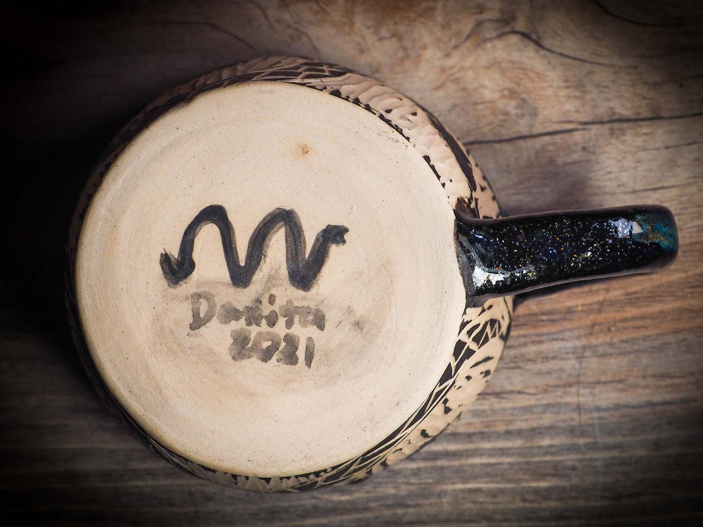 An original Halloween ceramic mug tumbler bowl handmade by Idania Salcido the artist behind Danita Art. Made with wheel thrown clay hand carved and glazed by the artist. Witches, ghosts, goblins, black cats, vampires give a folk art primitive feel to it. Perfect for Halloween Candy, ice cream and fruit, a pet cat bowl.