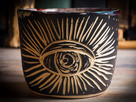 An original Halloween ceramic mug tumbler bowl handmade by Idania Salcido the artist behind Danita Art. Made with wheel thrown clay hand carved and glazed by the artist. Witches, ghosts, goblins, black cats, vampires give a folk art primitive feel to it. Perfect for Halloween Candy, ice cream and fruit, a pet cat bowl.