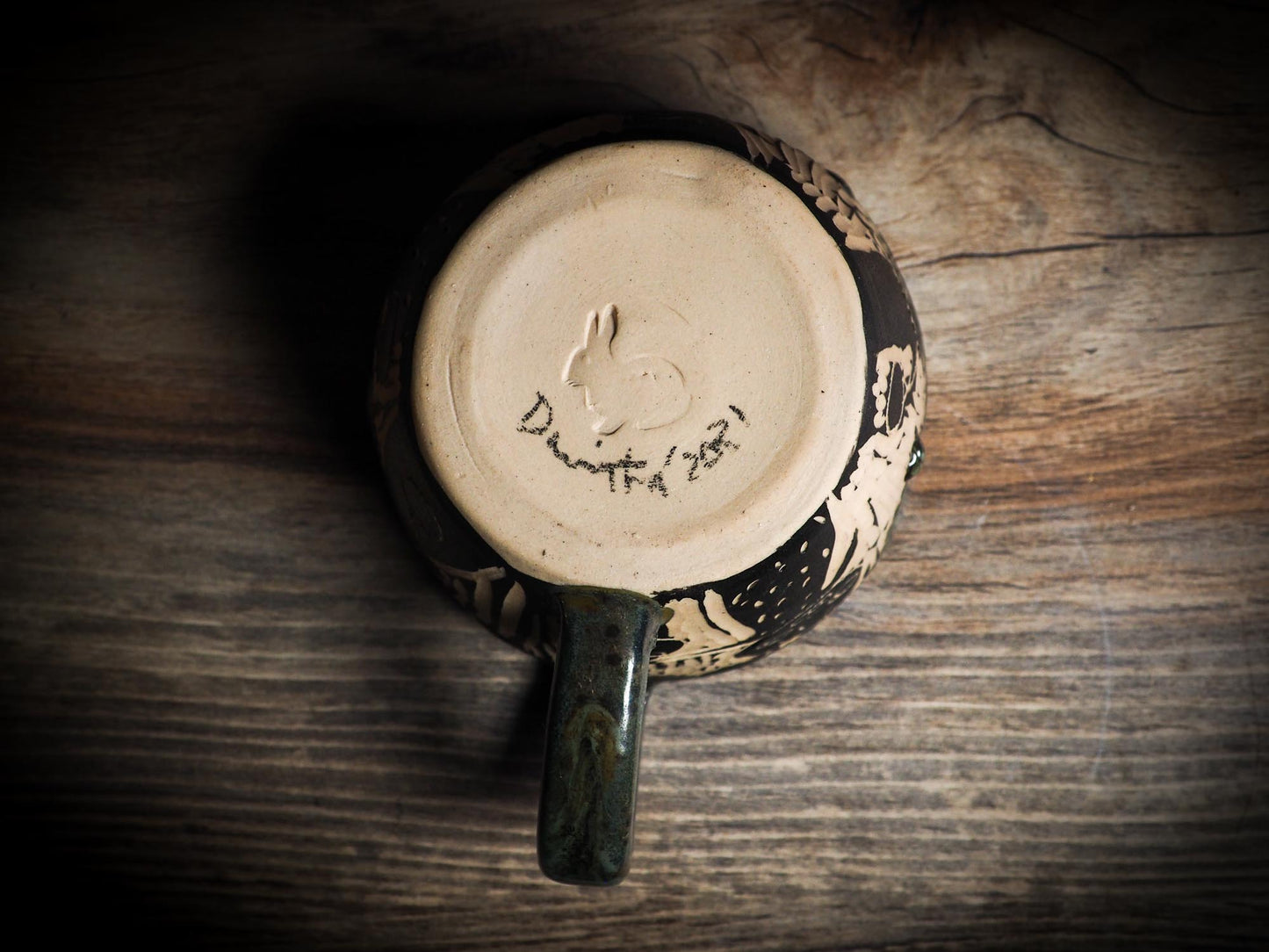 An original Halloween ceramic mug tumbler bowl handmade by Idania Salcido the artist behind Danita Art. Made with wheel thrown clay hand carved and glazed by the artist. Witches, ghosts, goblins, black cats, vampires give a folk art primitive feel to it. Perfect for Halloween Candy, ice cream and fruit, a pet cat bowl.