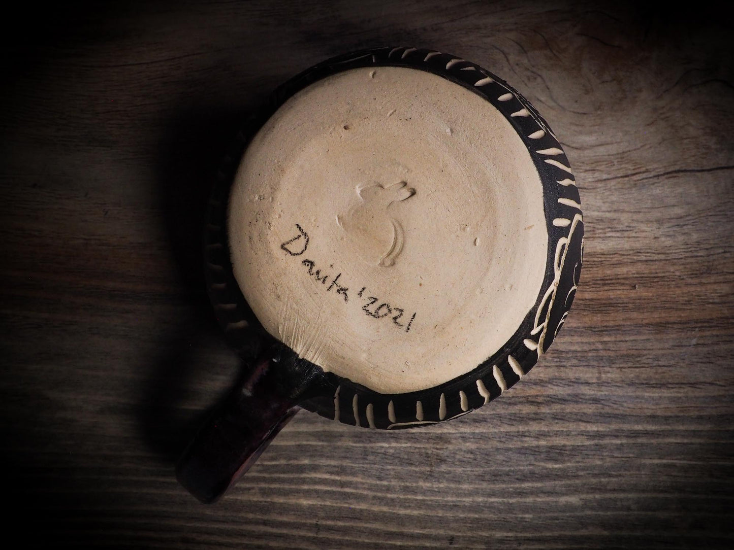 An original Halloween ceramic mug tumbler bowl handmade by Idania Salcido the artist behind Danita Art. Made with wheel thrown clay hand carved and glazed by the artist. Witches, ghosts, goblins, black cats, vampires give a folk art primitive feel to it. Perfect for Halloween Candy, ice cream and fruit, a pet cat bowl.