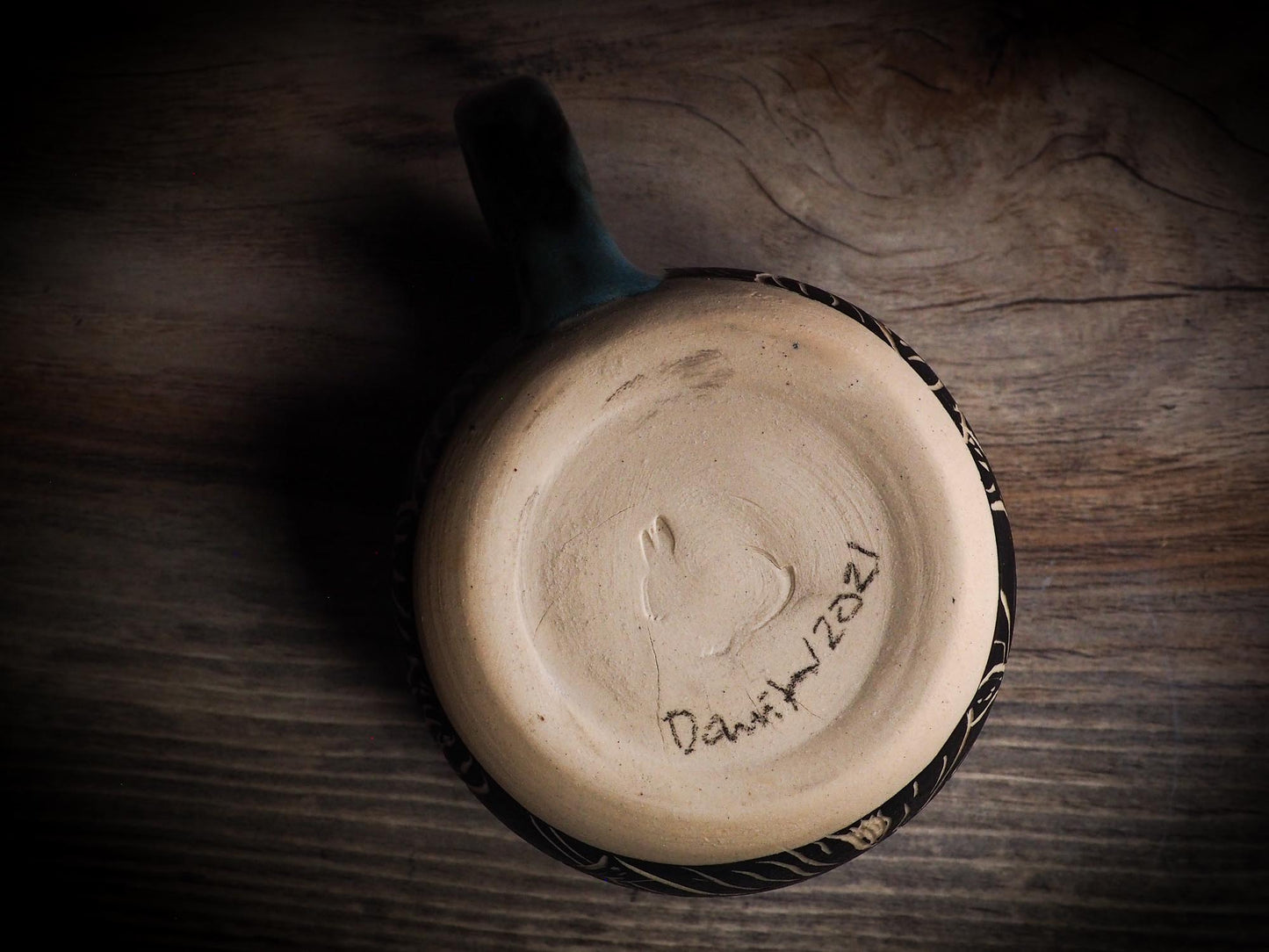 An original Halloween ceramic mug tumbler bowl handmade by Idania Salcido the artist behind Danita Art. Made with wheel thrown clay hand carved and glazed by the artist. Witches, ghosts, goblins, black cats, vampires give a folk art primitive feel to it. Perfect for Halloween Candy, ice cream and fruit, a pet cat bowl.