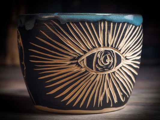 An original Halloween ceramic mug tumbler bowl handmade by Idania Salcido the artist behind Danita Art. Made with wheel thrown clay hand carved and glazed by the artist. Witches, ghosts, goblins, black cats, vampires give a folk art primitive feel to it. Perfect for Halloween Candy, ice cream and fruit, a pet cat bowl.