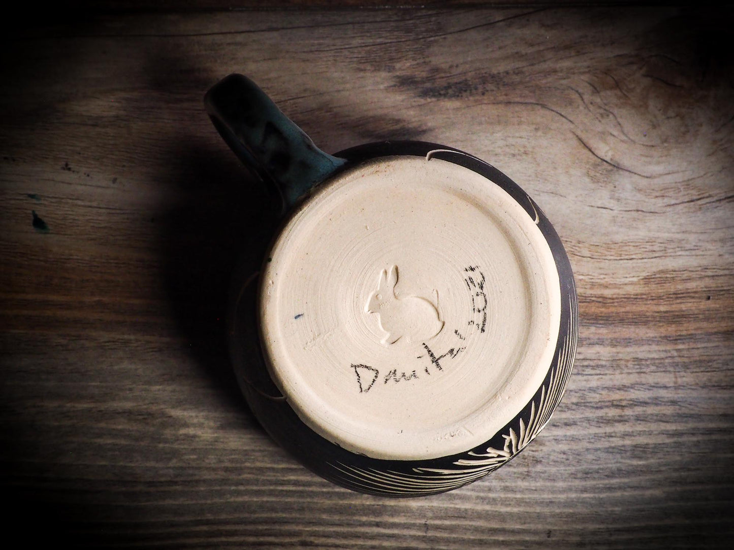 An original Halloween ceramic mug tumbler bowl handmade by Idania Salcido the artist behind Danita Art. Made with wheel thrown clay hand carved and glazed by the artist. Witches, ghosts, goblins, black cats, vampires give a folk art primitive feel to it. Perfect for Halloween Candy, ice cream and fruit, a pet cat bowl.