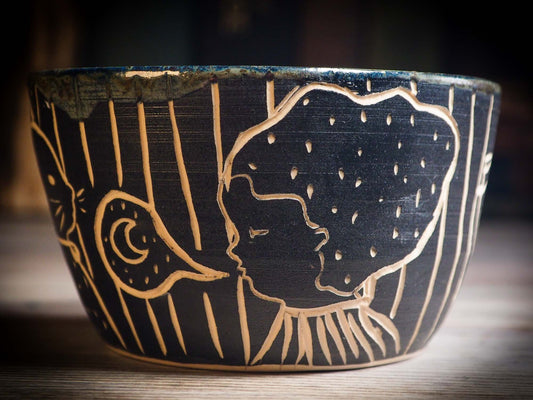 An original Halloween ceramic mug tumbler bowl handmade by Idania Salcido the artist behind Danita Art. Made with wheel thrown clay hand carved and glazed by the artist. Witches, ghosts, goblins, black cats, vampires give a folk art primitive feel to it. Perfect for Halloween Candy, ice cream and fruit, a pet cat bowl.