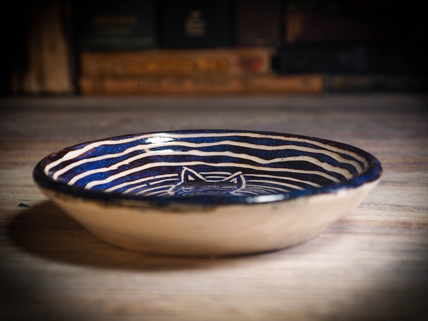 An original Halloween ceramic mug tumbler bowl handmade by Idania Salcido the artist behind Danita Art. Made with wheel thrown clay hand carved and glazed by the artist. Witches, ghosts, goblins, black cats, vampires give a folk art primitive feel to it. Perfect for Halloween Candy, ice cream and fruit, a pet cat bowl.