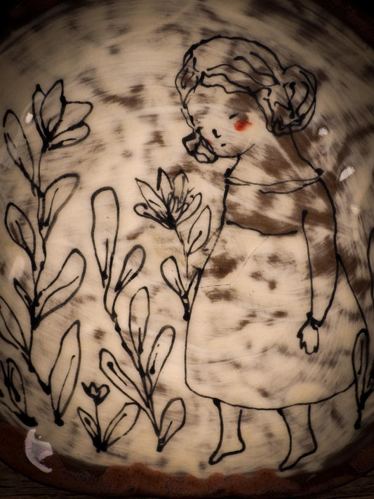 An original glazed ceramic food plate by Idania Salcido, the artist behind Danita Art. Totally handmade in my studio, this is a unique piece that cannot be repeated. Food and drink safe, hand wash only. Brown earth tones and an ink drawing of a girl on the outside.