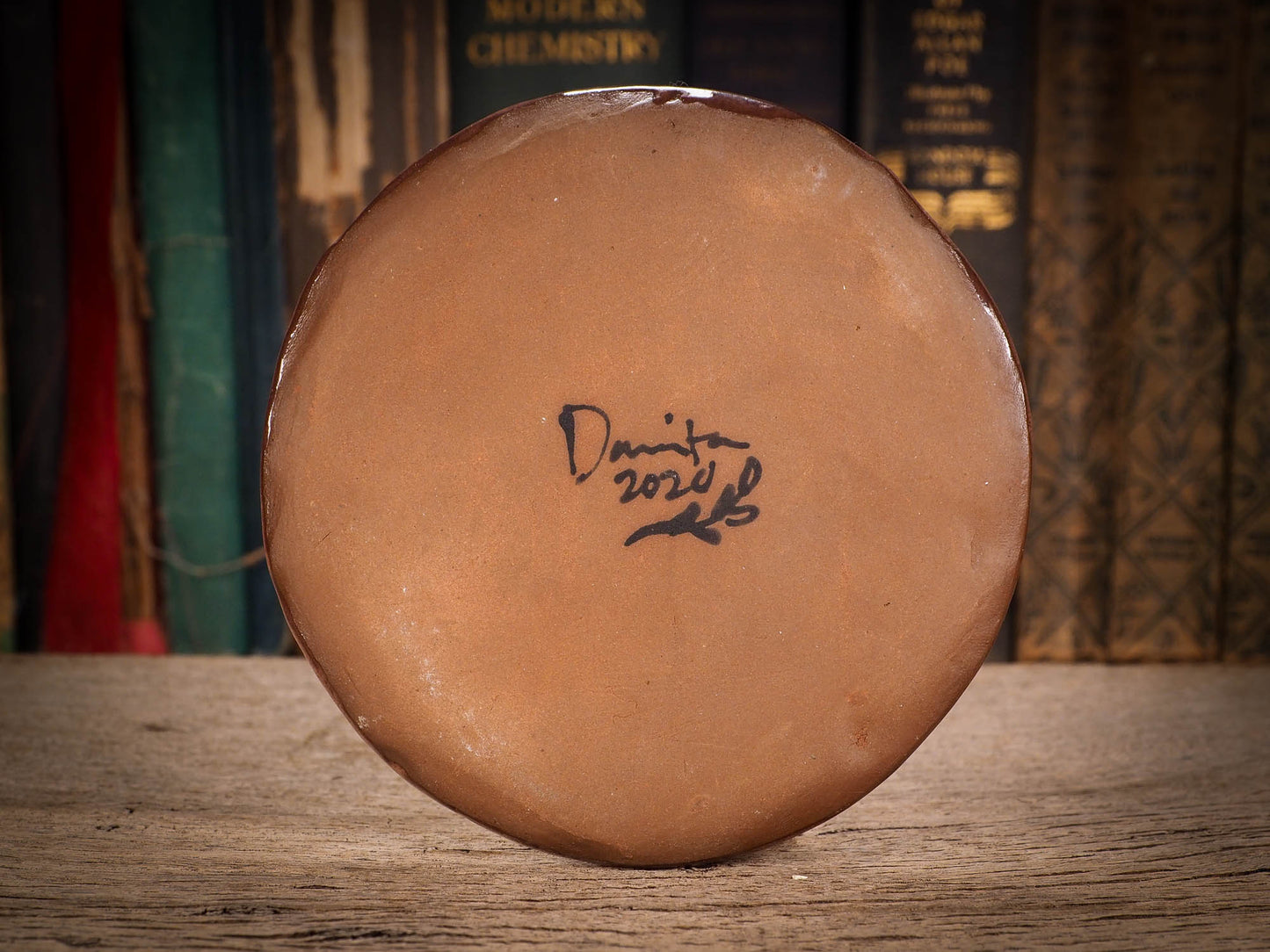 An original glazed ceramic food plate by Idania Salcido, the artist behind Danita Art. Totally handmade in my studio, this is a unique piece that cannot be repeated. Food and drink safe, hand wash only. Brown earth tones and an ink drawing of a girl on the outside.