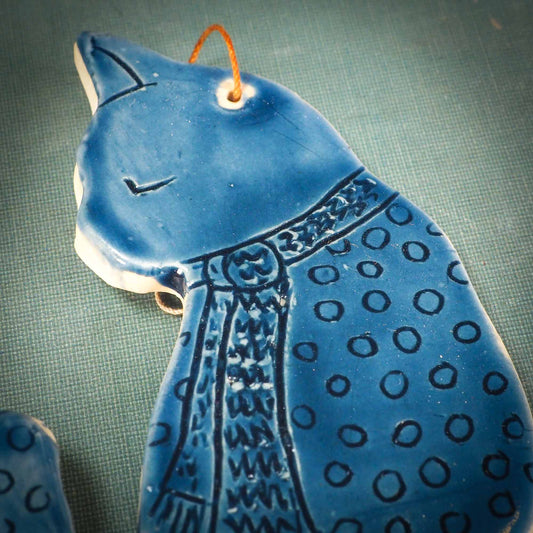 An original Christmas Holiday tree ornament ceramic cat, handmade by Idania Salcido the artist behind Danita Art. Glazed carved sgraffito stoneware, hand painted and decorated, it has a beautiful vintage glass tree ornament to adorn a unique holiday gift for family and friends. Christmas gift for animal and pet lovers.
