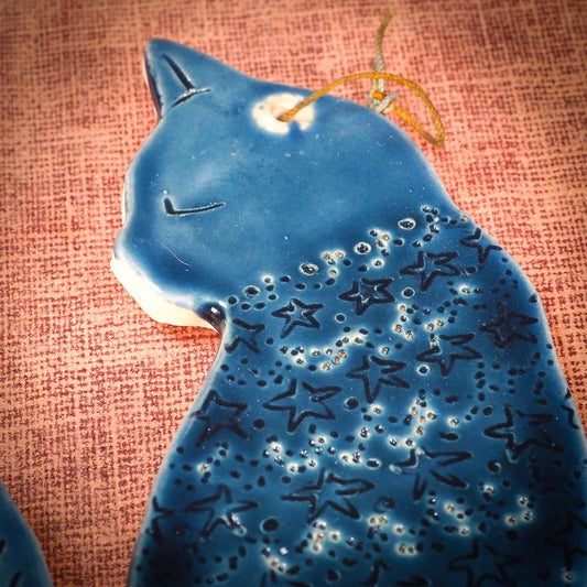 An original Christmas Holiday tree ornament ceramic cat, handmade by Idania Salcido the artist behind Danita Art. Glazed carved sgraffito stoneware, hand painted and decorated, it has a beautiful vintage glass tree ornament to adorn a unique holiday gift for family and friends. Christmas gift for animal and pet lovers.