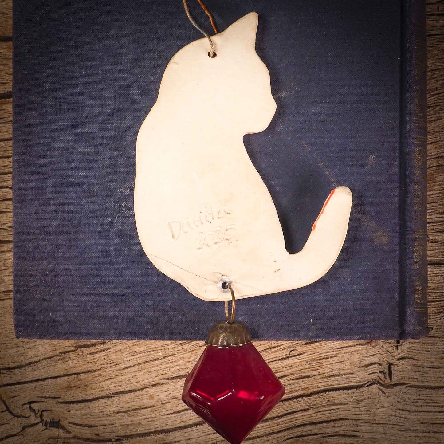 An original Christmas Holiday tree ornament ceramic cat, handmade by Idania Salcido the artist behind Danita Art. Glazed carved sgraffito stoneware, hand painted and decorated, it has a beautiful vintage glass tree ornament to adorn a unique holiday gift for family and friends. Christmas gift for animal and pet lovers.