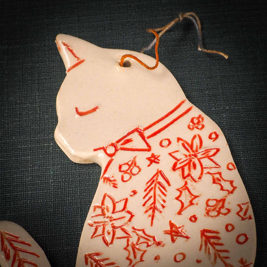 An original Christmas Holiday tree ornament ceramic cat, handmade by Idania Salcido the artist behind Danita Art. Glazed carved sgraffito stoneware, hand painted and decorated, it has a beautiful vintage glass tree ornament to adorn a unique holiday gift for family and friends. Christmas gift for animal and pet lovers.