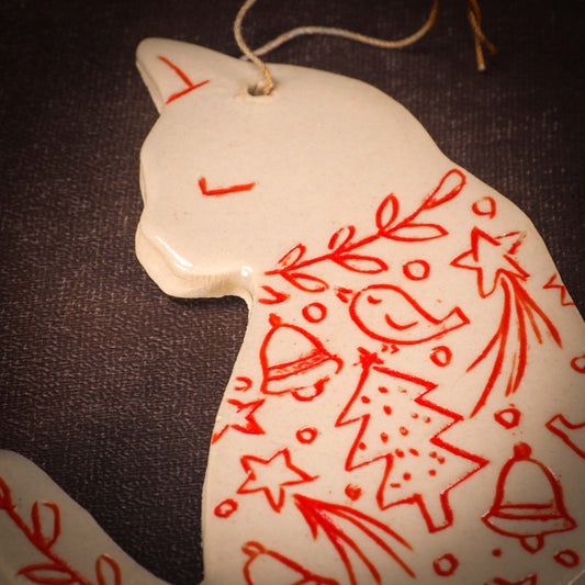 An original Christmas Holiday tree ornament ceramic cat, handmade by Idania Salcido the artist behind Danita Art. Glazed carved sgraffito stoneware, hand painted and decorated, it has a beautiful vintage glass tree ornament to adorn a unique holiday gift for family and friends. Christmas gift for animal and pet lovers.