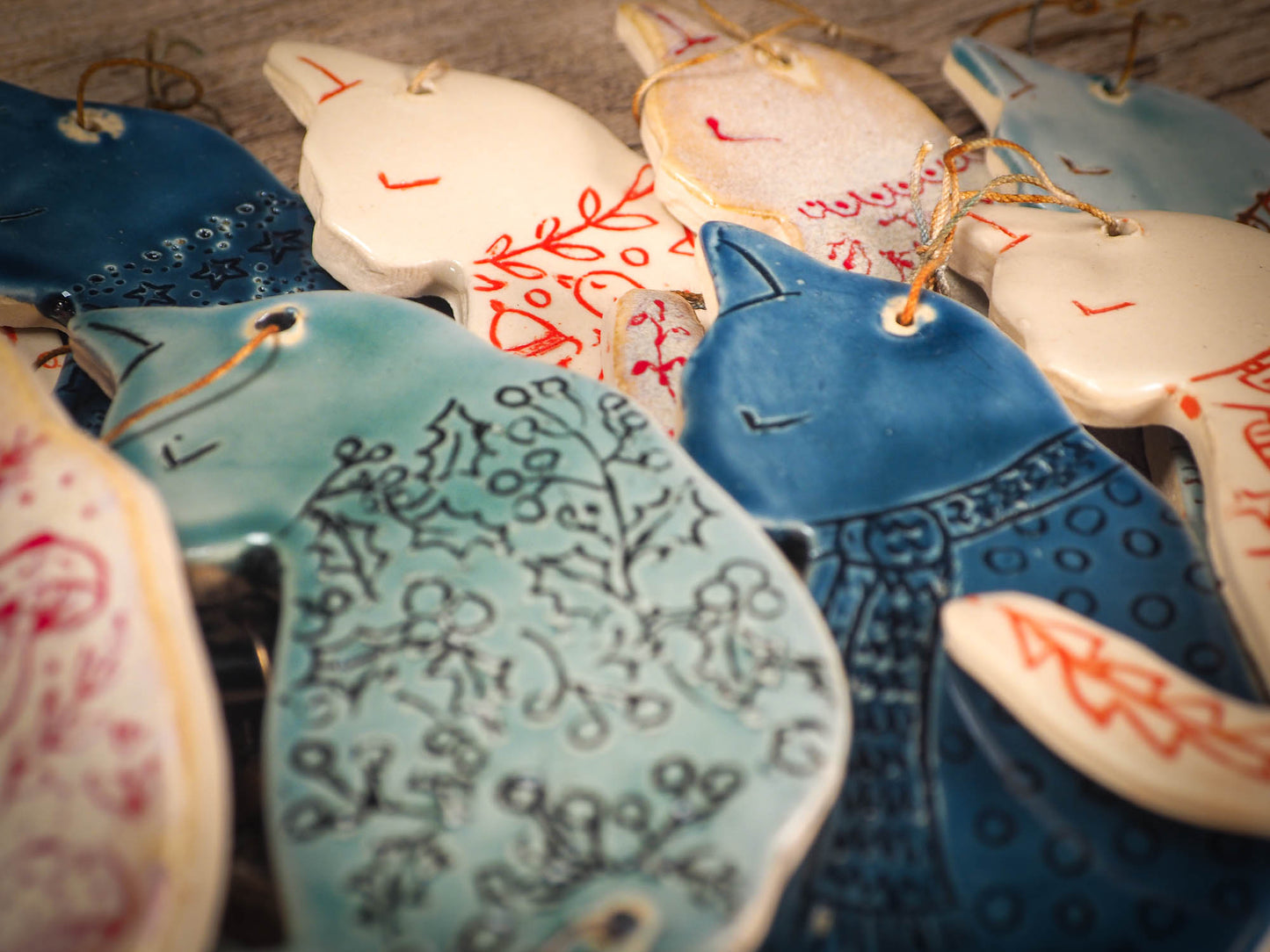 An original Christmas Holiday tree ornament ceramic cat, handmade by Idania Salcido the artist behind Danita Art. Glazed carved sgraffito stoneware, hand painted and decorated, it has a beautiful vintage glass tree ornament to adorn a unique holiday gift for family and friends. Christmas gift for animal and pet lovers.