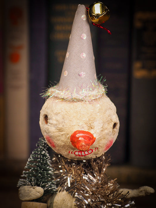 Adorable handmade spun cotton Art Doll Christmas tree ornament by Idania Salcido, the artist by Danita Art. Hand painted by the artist holiday figurine with paper hat with tinsel and vintage style garlands and a tiny Christmas tree. Hang this handmade ornament from your Christmas tree or use as Holiday decoration.