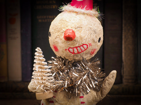 Adorable handmade spun cotton Art Doll Christmas tree ornament by Idania Salcido, the artist by Danita Art. Hand painted by the artist holiday figurine with paper hat with tinsel and vintage style garlands and a tiny Christmas tree. Hang this handmade ornament from your Christmas tree or use as Holiday decoration.