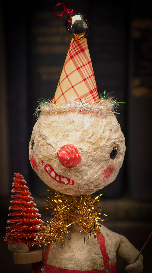 Adorable handmade spun cotton Art Doll Christmas tree ornament by Idania Salcido, the artist by Danita Art. Hand painted by the artist holiday figurine with paper hat with tinsel and vintage style garlands and a tiny Christmas tree. Hang this handmade ornament from your Christmas tree or use as Holiday decoration.