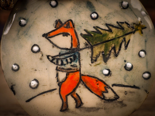 An original Christmas Holiday tree round glazed ceramic ornament handmade by Idania Salcido, the artist behind Danita Art. Glazed carved sgraffito stoneware, hand painted and decorated, it is illustrated by hand with winter scenes with snowmen, Christmas trees, Santa Claus, snow balls and winter themes.