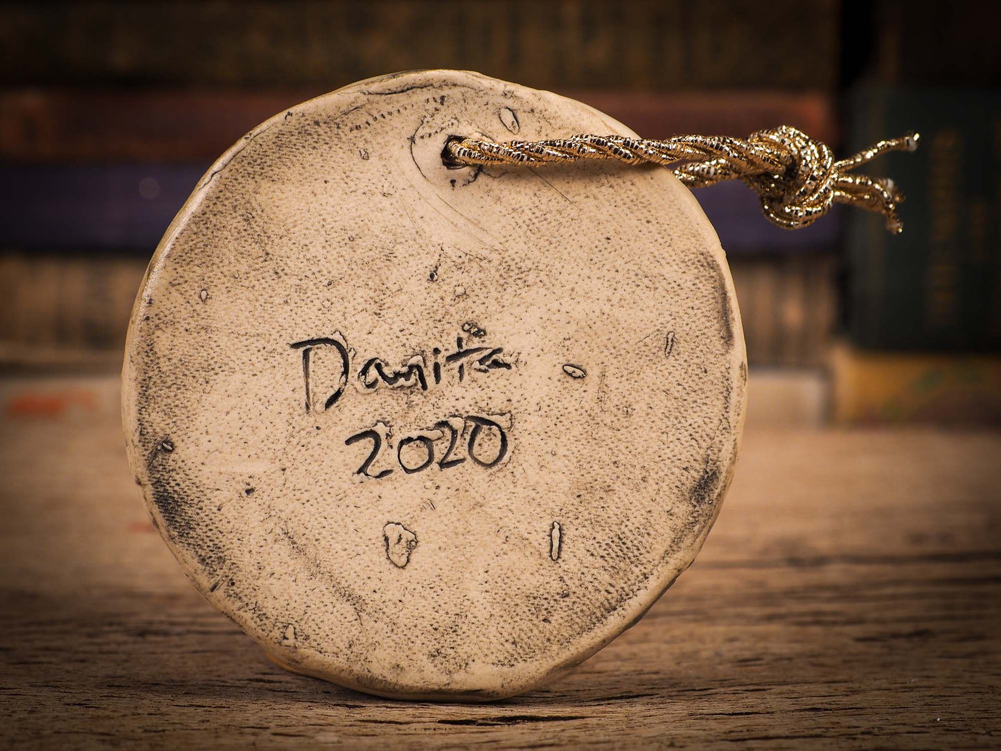 An original Christmas Holiday tree round glazed ceramic ornament handmade by Idania Salcido, the artist behind Danita Art. Glazed carved sgraffito stoneware, hand painted and decorated, it is illustrated by hand with winter scenes with snowmen, Christmas trees, Santa Claus, snow balls and winter themes.