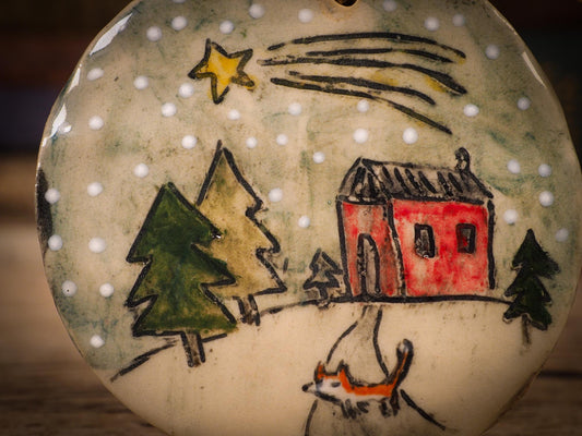 An original Christmas Holiday tree round glazed ceramic ornament handmade by Idania Salcido, the artist behind Danita Art. Glazed carved sgraffito stoneware, hand painted and decorated, it is illustrated by hand with winter scenes with snowmen, Christmas trees, Santa Claus, snow balls and winter themes.