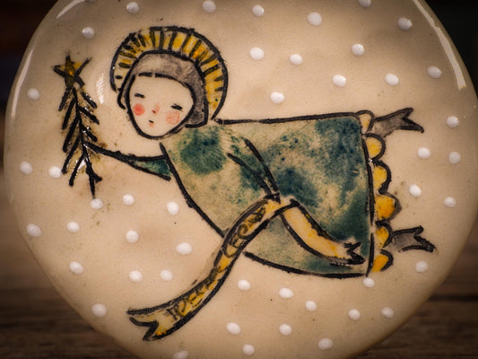 An original Christmas Holiday tree round glazed ceramic ornament handmade by Idania Salcido, the artist behind Danita Art. Glazed carved sgraffito stoneware, hand painted and decorated, it is illustrated by hand with winter scenes with snowmen, Christmas trees, Santa Claus, snow balls and winter themes.