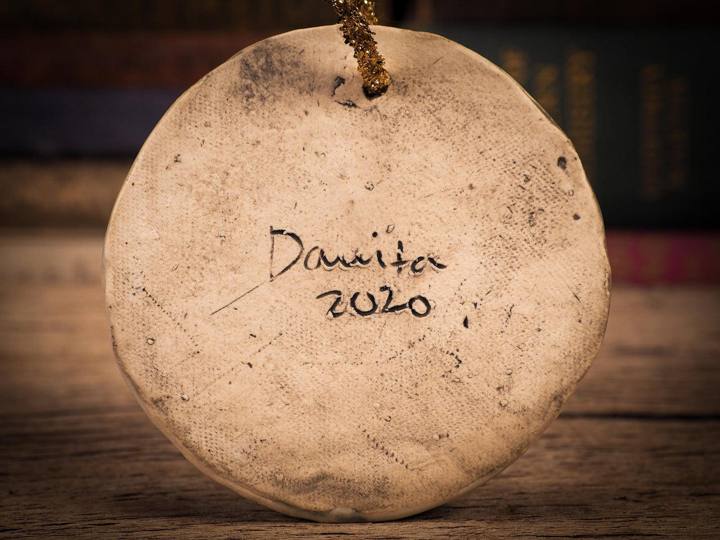 An original Christmas Holiday tree round glazed ceramic ornament handmade by Idania Salcido, the artist behind Danita Art. Glazed carved sgraffito stoneware, hand painted and decorated, it is illustrated by hand with winter scenes with snowmen, Christmas trees, Santa Claus, snow balls and winter themes.