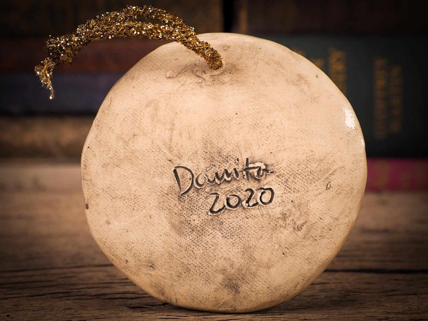 An original Christmas Holiday tree round glazed ceramic ornament handmade by Idania Salcido, the artist behind Danita Art. Glazed carved sgraffito stoneware, hand painted and decorated, it is illustrated by hand with winter scenes with snowmen, Christmas trees, Santa Claus, snow balls and winter themes.