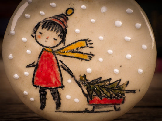 An original Christmas Holiday tree round glazed ceramic ornament handmade by Idania Salcido, the artist behind Danita Art. Glazed carved sgraffito stoneware, hand painted and decorated, it is illustrated by hand with winter scenes with snowmen, Christmas trees, Santa Claus, snow balls and winter themes.