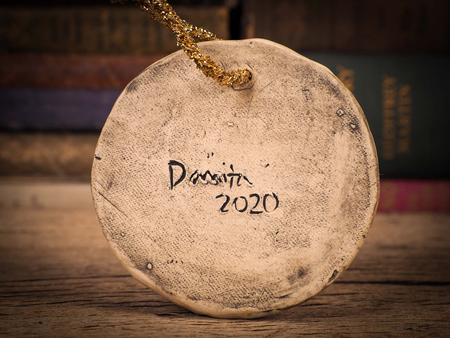 An original Christmas Holiday tree round glazed ceramic ornament handmade by Idania Salcido, the artist behind Danita Art. Glazed carved sgraffito stoneware, hand painted and decorated, it is illustrated by hand with winter scenes with snowmen, Christmas trees, Santa Claus, snow balls and winter themes.