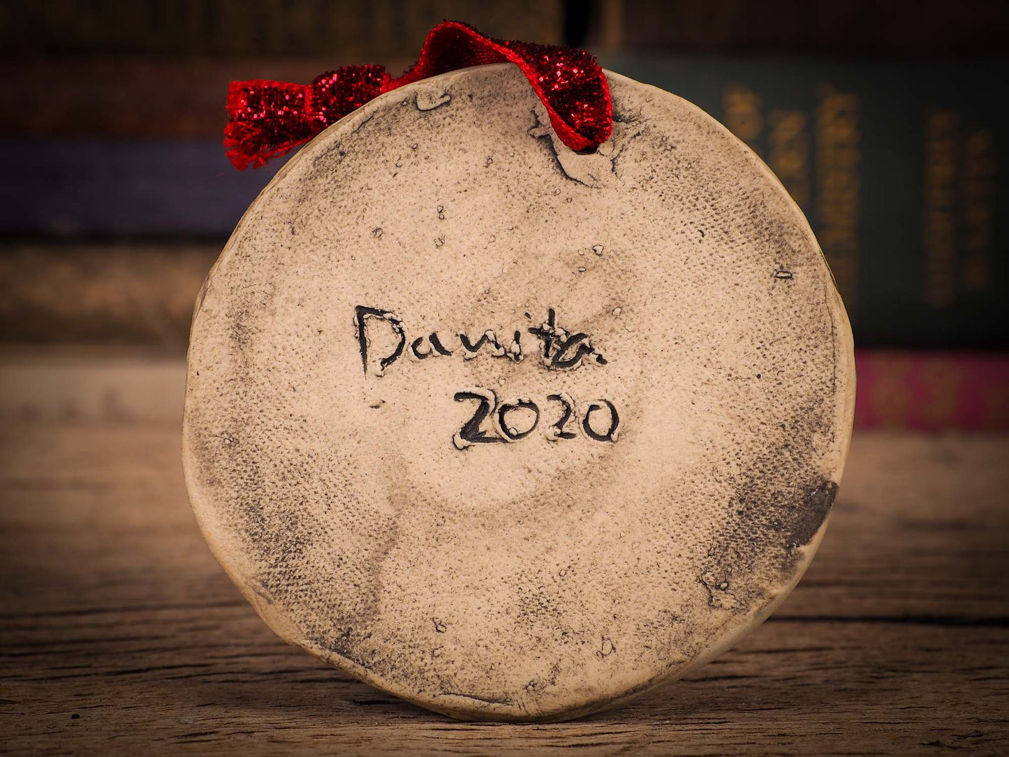 An original Christmas Holiday tree round glazed ceramic ornament handmade by Idania Salcido, the artist behind Danita Art. Glazed carved sgraffito stoneware, hand painted and decorated, it is illustrated by hand with winter scenes with snowmen, Christmas trees, Santa Claus, snow balls and winter themes.