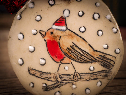 An original Christmas Holiday tree round glazed ceramic ornament handmade by Idania Salcido, the artist behind Danita Art. Glazed carved sgraffito stoneware, hand painted and decorated, it is illustrated by hand with winter scenes with snowmen, Christmas trees, Santa Claus, snow balls and winter themes.