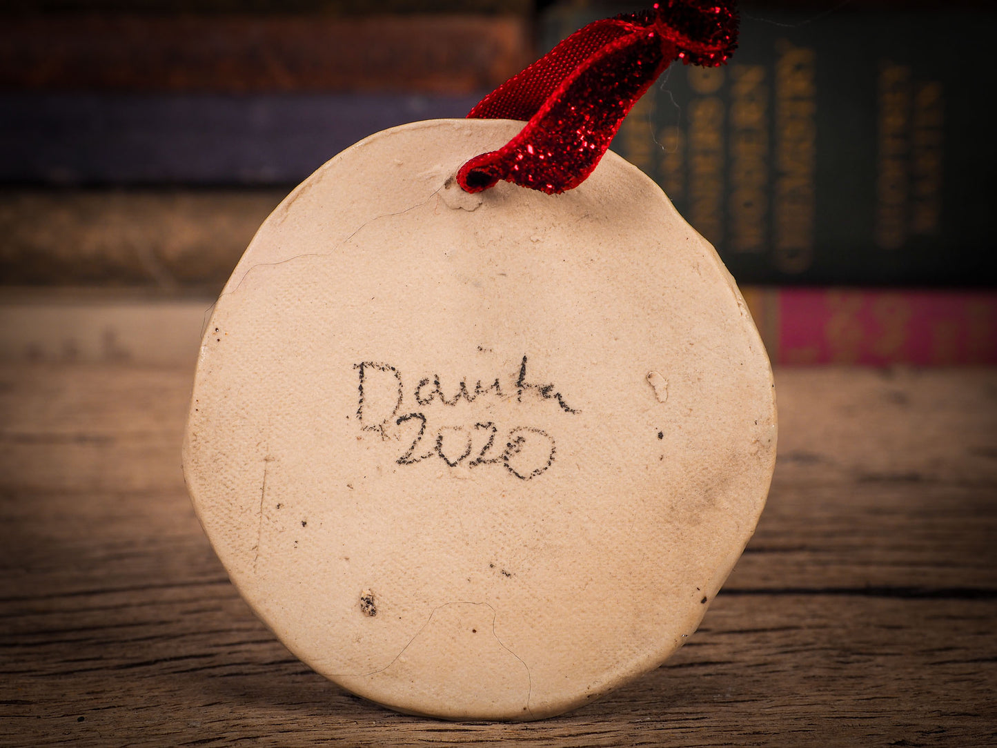 An original Christmas Holiday tree round glazed ceramic ornament handmade by Idania Salcido, the artist behind Danita Art. Glazed carved sgraffito stoneware, hand painted and decorated, it is illustrated by hand with winter scenes with snowmen, Christmas trees, Santa Claus, snow balls and winter themes.