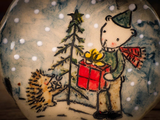 An original Christmas Holiday tree round glazed ceramic ornament handmade by Idania Salcido, the artist behind Danita Art. Glazed carved sgraffito stoneware, hand painted and decorated, it is illustrated by hand with winter scenes with snowmen, Christmas trees, Santa Claus, snow balls and winter themes.