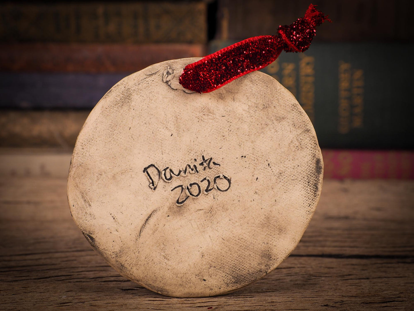 An original Christmas Holiday tree round glazed ceramic ornament handmade by Idania Salcido, the artist behind Danita Art. Glazed carved sgraffito stoneware, hand painted and decorated, it is illustrated by hand with winter scenes with snowmen, Christmas trees, Santa Claus, snow balls and winter themes.