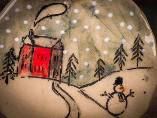 An original Christmas Holiday tree round glazed ceramic ornament handmade by Idania Salcido, the artist behind Danita Art. Glazed carved sgraffito stoneware, hand painted and decorated, it is illustrated by hand with winter scenes with snowmen, Christmas trees, Santa Claus, snow balls and winter themes.
