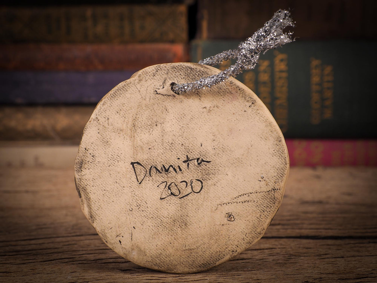 An original Christmas Holiday tree round glazed ceramic ornament handmade by Idania Salcido, the artist behind Danita Art. Glazed carved sgraffito stoneware, hand painted and decorated, it is illustrated by hand with winter scenes with snowmen, Christmas trees, Santa Claus, snow balls and winter themes.