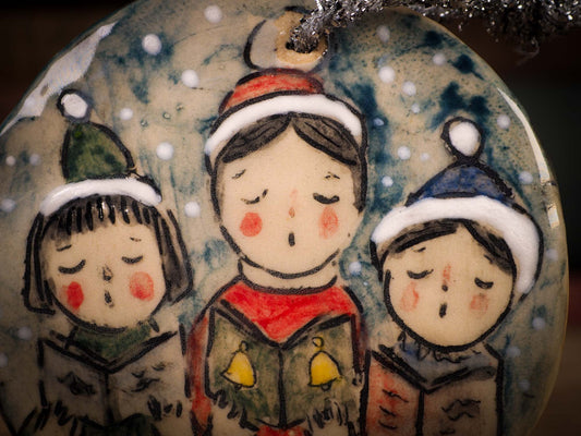 An original Christmas Holiday tree round glazed ceramic ornament handmade by Idania Salcido, the artist behind Danita Art. Glazed carved sgraffito stoneware, hand painted and decorated, it is illustrated by hand with winter scenes with snowmen, Christmas trees, Santa Claus, snow balls and winter themes.