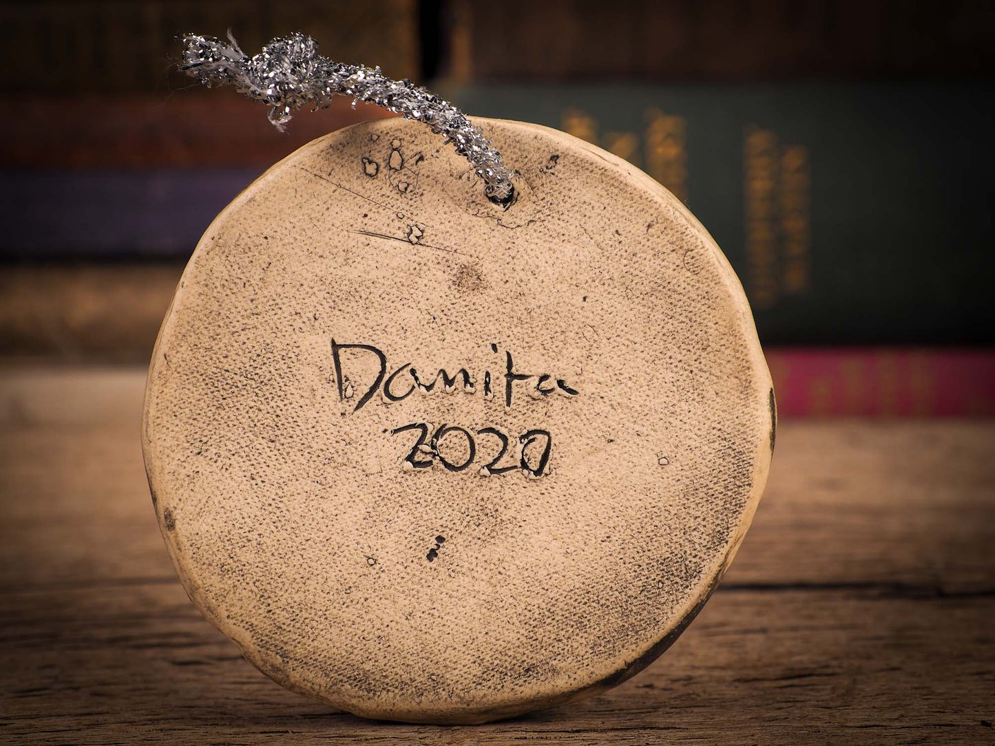 An original Christmas Holiday tree round glazed ceramic ornament handmade by Idania Salcido, the artist behind Danita Art. Glazed carved sgraffito stoneware, hand painted and decorated, it is illustrated by hand with winter scenes with snowmen, Christmas trees, Santa Claus, snow balls and winter themes.