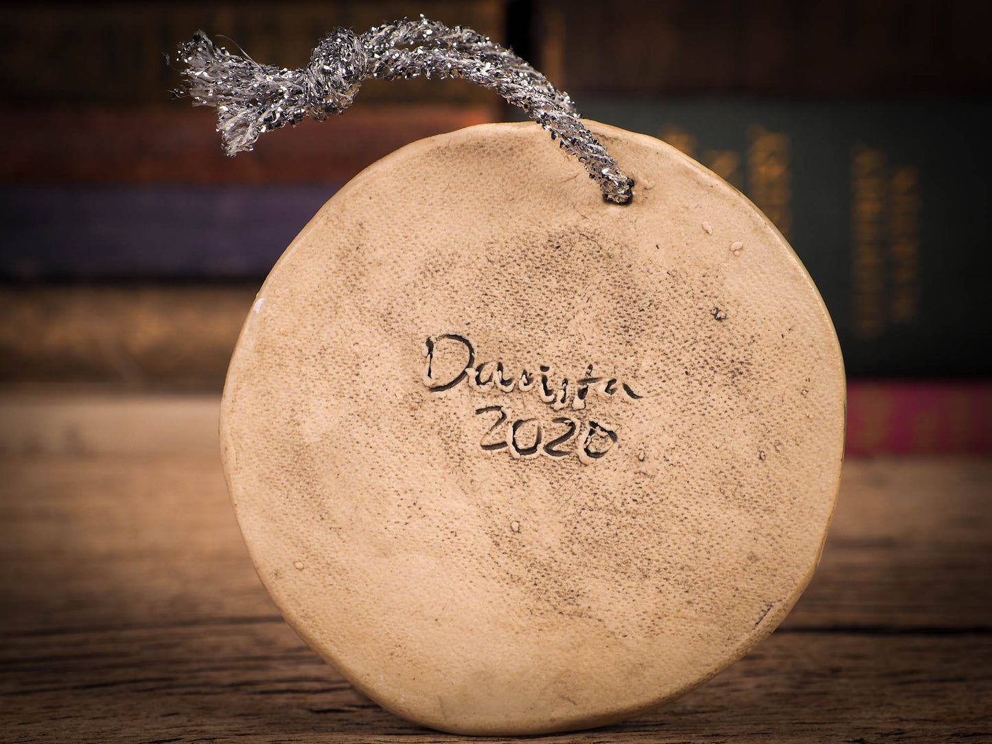 An original Christmas Holiday tree round glazed ceramic ornament handmade by Idania Salcido, the artist behind Danita Art. Glazed carved sgraffito stoneware, hand painted and decorated, it is illustrated by hand with winter scenes with snowmen, Christmas trees, Santa Claus, snow balls and winter themes.