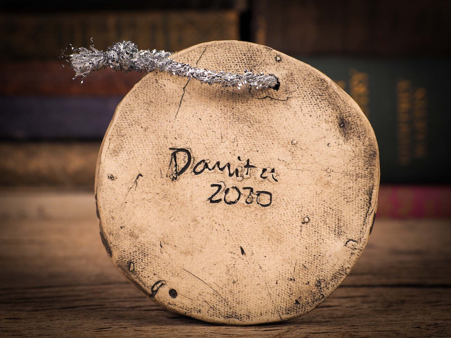 An original Christmas Holiday tree round glazed ceramic ornament handmade by Idania Salcido, the artist behind Danita Art. Glazed carved sgraffito stoneware, hand painted and decorated, it is illustrated by hand with winter scenes with snowmen, Christmas trees, Santa Claus, snow balls and winter themes.