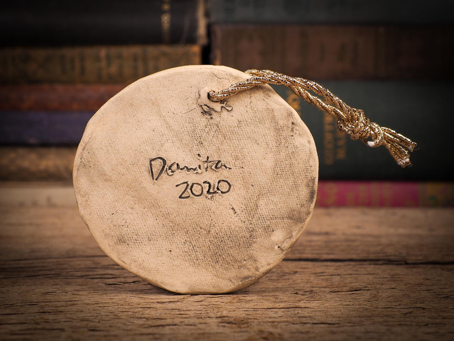 An original Christmas Holiday tree round glazed ceramic ornament handmade by Idania Salcido, the artist behind Danita Art. Glazed carved sgraffito stoneware, hand painted and decorated, it is illustrated by hand with winter scenes with snowmen, Christmas trees, Santa Claus, snow balls and winter themes.