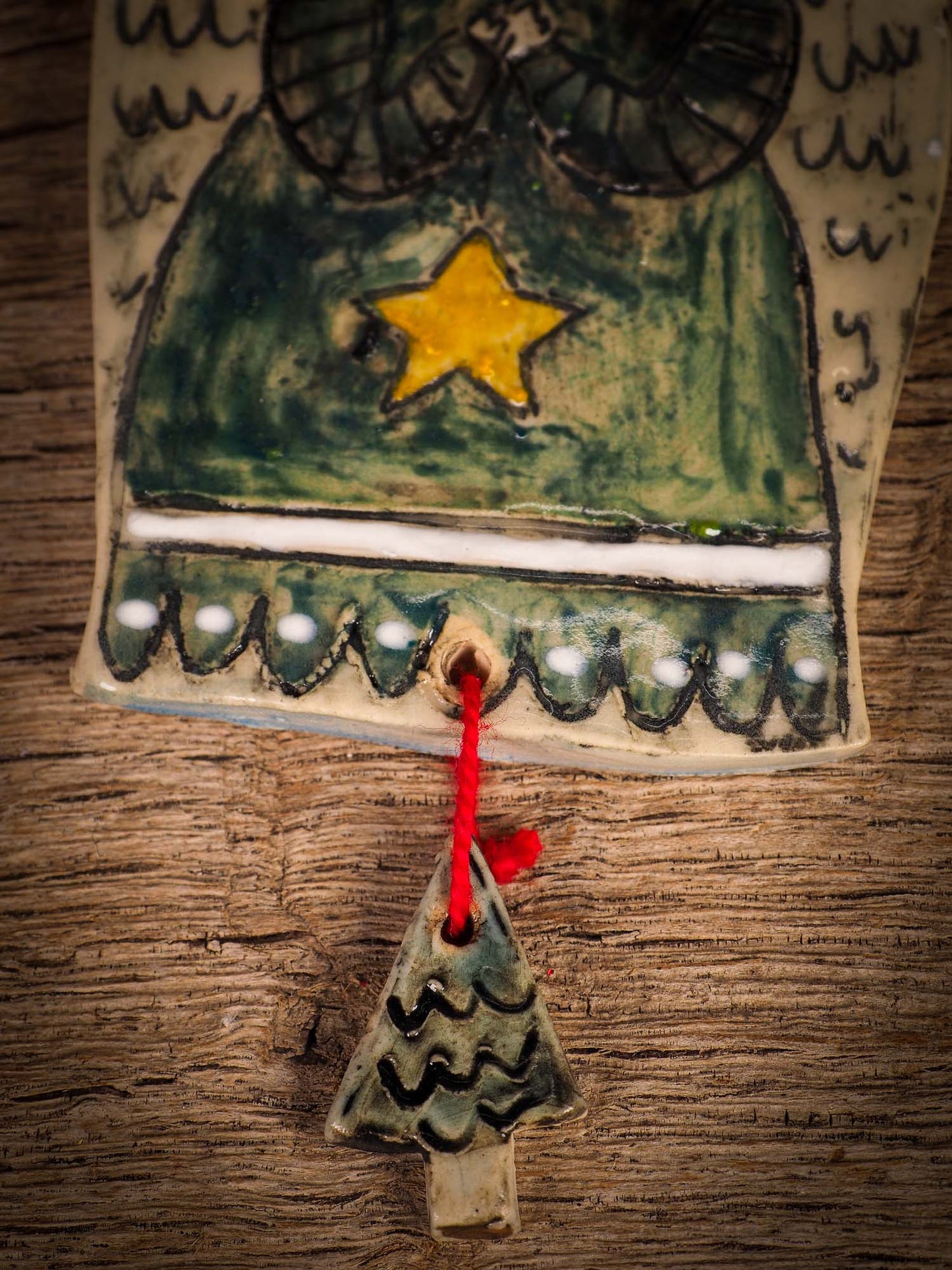 An original Christmas Holiday tree round glazed ceramic ornament handmade by Idania Salcido, the artist behind Danita Art. Glazed carved sgraffito stoneware, hand painted and decorated, it is illustrated by hand with snowmen, Christmas trees, Santa Claus, angels and snow balls and winter themes.