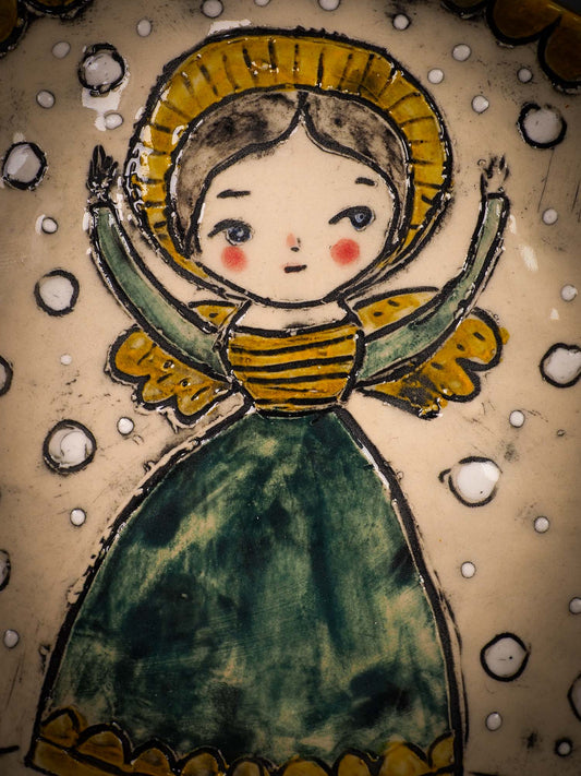 An original Christmas Holiday cake dinner plate round glazed ceramic dinnerware handmade by Idania Salcido, the artist behind Danita Art. Glazed carved sgraffito stoneware, hand painted and decorated, it is illustrated by hand with snowmen, Christmas trees, Santa Claus, angels and snow balls and winter themes.