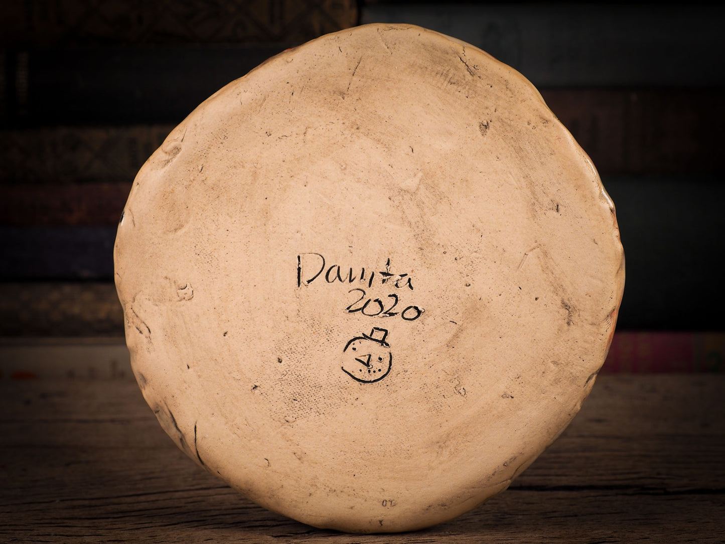 An original Christmas Holiday cake dinner plate round glazed ceramic dinnerware handmade by Idania Salcido, the artist behind Danita Art. Glazed carved sgraffito stoneware, hand painted and decorated, it is illustrated by hand with snowmen, Christmas trees, Santa Claus, angels and snow balls and winter themes.