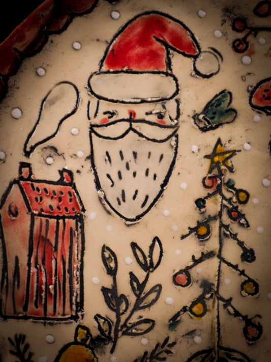 An original Christmas Holiday cake dinner dessert plate round glazed ceramic dinnerware handmade by Idania Salcido, the artist behind Danita Art. Glazed carved sgraffito stoneware, hand painted and decorated, it is illustrated by hand with snowmen, Christmas trees, Santa Claus, angels and snow balls and winter themes.