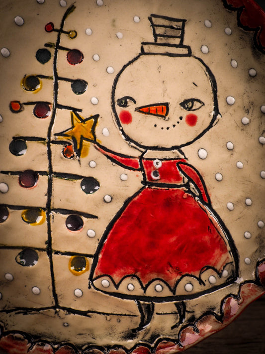 An original Christmas Holiday cake dinner dessert plate round glazed ceramic dinnerware handmade by Idania Salcido, the artist behind Danita Art. Glazed carved sgraffito stoneware, hand painted and decorated, it is illustrated by hand with snowmen, Christmas trees, Santa Claus, angels and snow balls and winter themes.