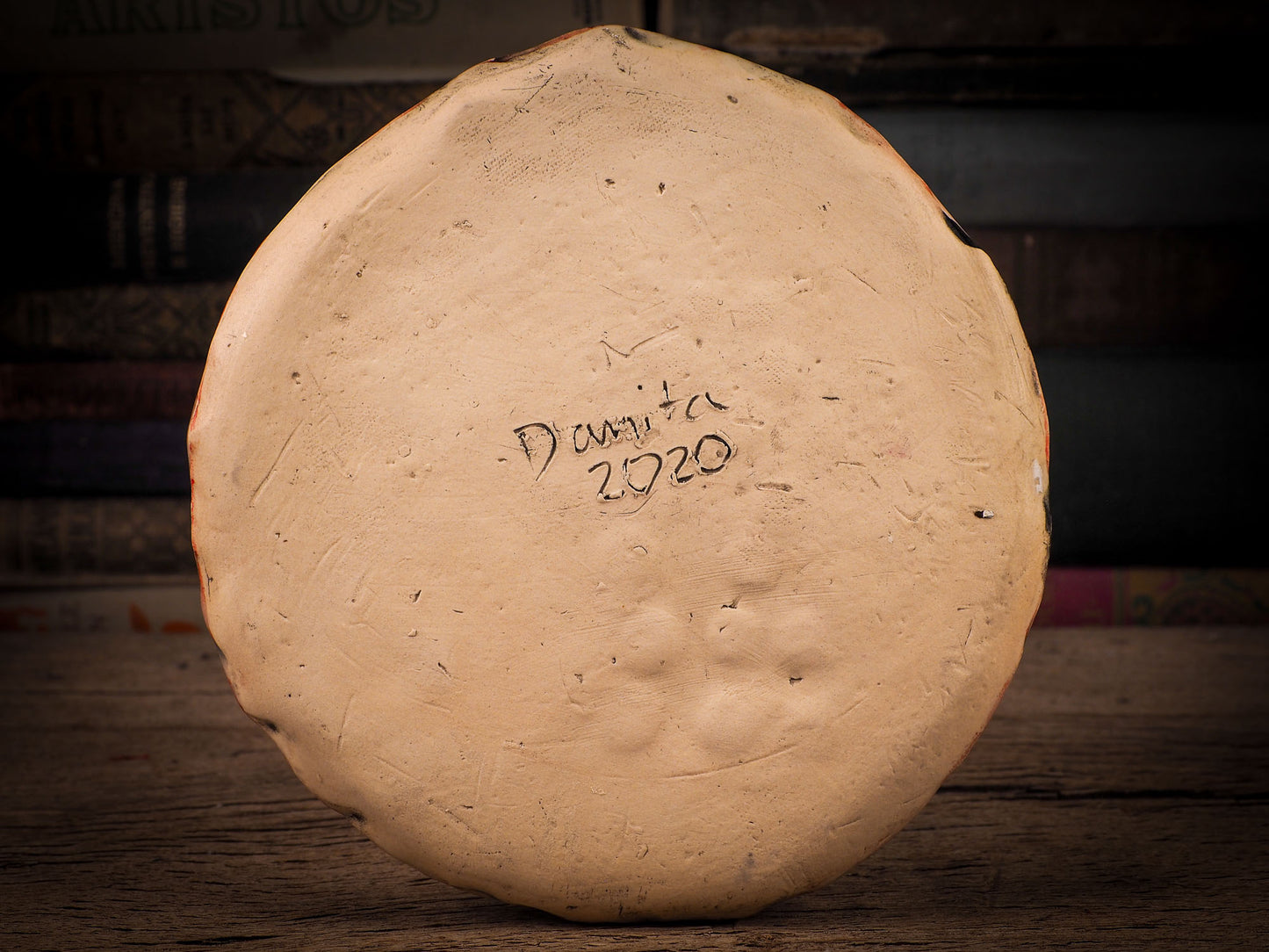 An original Christmas Holiday cake dinner dessert plate round glazed ceramic dinnerware handmade by Idania Salcido, the artist behind Danita Art. Glazed carved sgraffito stoneware, hand painted and decorated, it is illustrated by hand with snowmen, Christmas trees, Santa Claus, angels and snow men and winter themes.