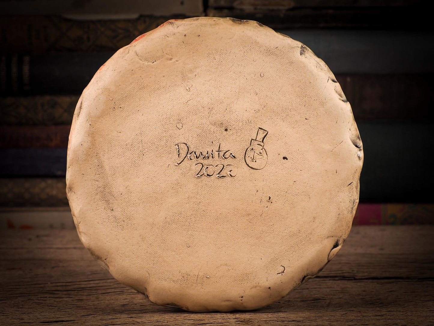 An original Christmas Holiday cake dinner dessert plate round glazed ceramic dinnerware handmade by Idania Salcido, the artist behind Danita Art. Glazed carved sgraffito stoneware, hand painted and decorated, it is illustrated by hand with snowmen, Christmas trees, Santa Claus, angels and snow balls and winter themes.