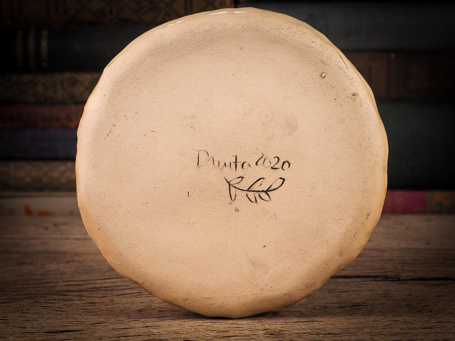 An original Christmas Holiday cake dinner dessert plate round glazed ceramic dinnerware handmade by Idania Salcido, the artist behind Danita Art. Glazed carved sgraffito stoneware, hand painted and decorated, it is illustrated by hand with snowmen, Christmas trees, Santa Claus, angels and snow balls and winter themes.