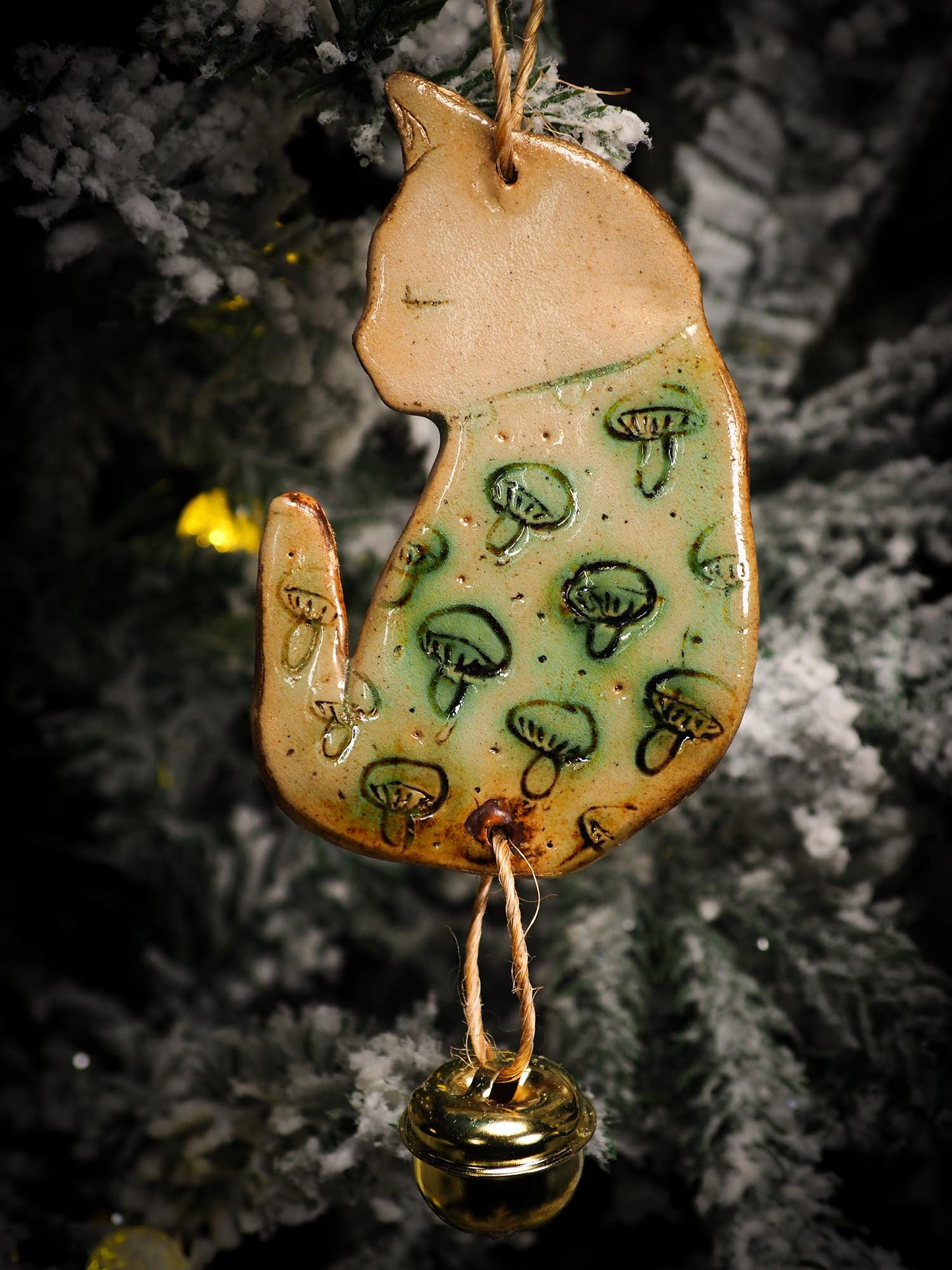 An original Christmas Holiday tree round glazed ceramic ornament handmade by Idania Salcido, the artist behind Danita Art. Glazed carved sgraffito stoneware, hand painted and decorated, it is illustrated by hand with snowmen, Christmas trees, Santa Claus, angels and snow balls and winter themes.