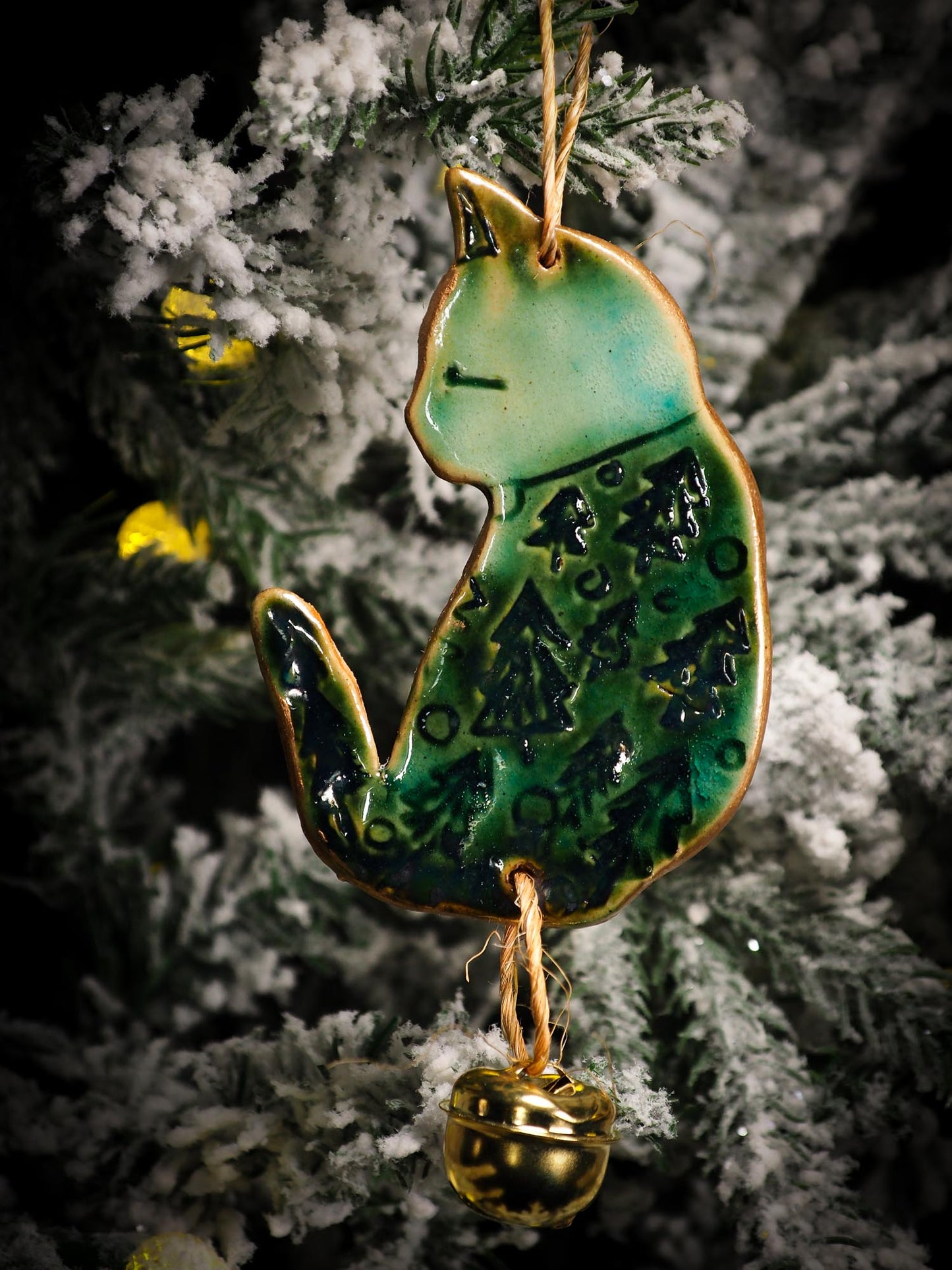 An original Christmas Holiday tree round glazed ceramic ornament handmade by Idania Salcido, the artist behind Danita Art. Glazed carved sgraffito stoneware, hand painted and decorated, it is illustrated by hand with snowmen, Christmas trees, Santa Claus, angels and snow balls and winter themes.